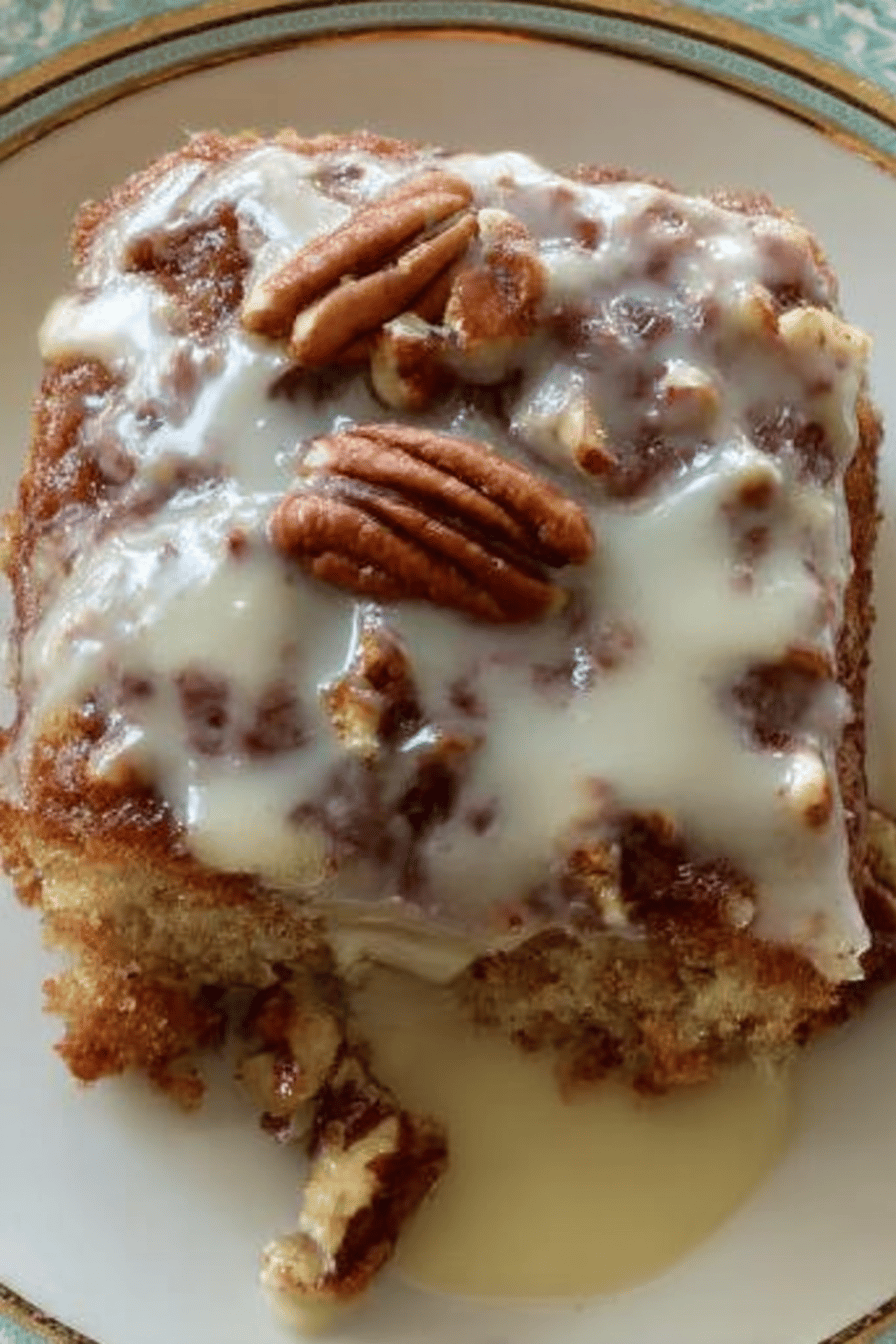 Butter Pecan Praline Poke Cake Recipe slice on plate showing perfect texture and swirl pattern