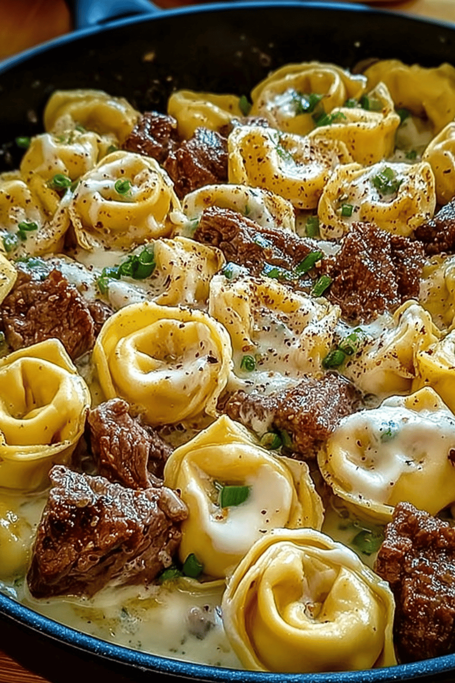 Cheesesteak Tortellini in a Creamy Provolone Cheese Sauce Recipe slice on plate showing perfect texture and swirl pattern