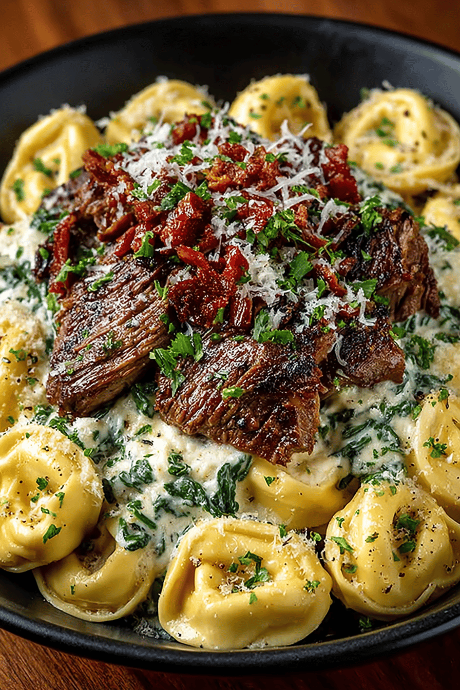 Cheesesteak Tortellini with a Creamy Provolone Sauce Recipe slice on plate showing perfect texture and swirl pattern
