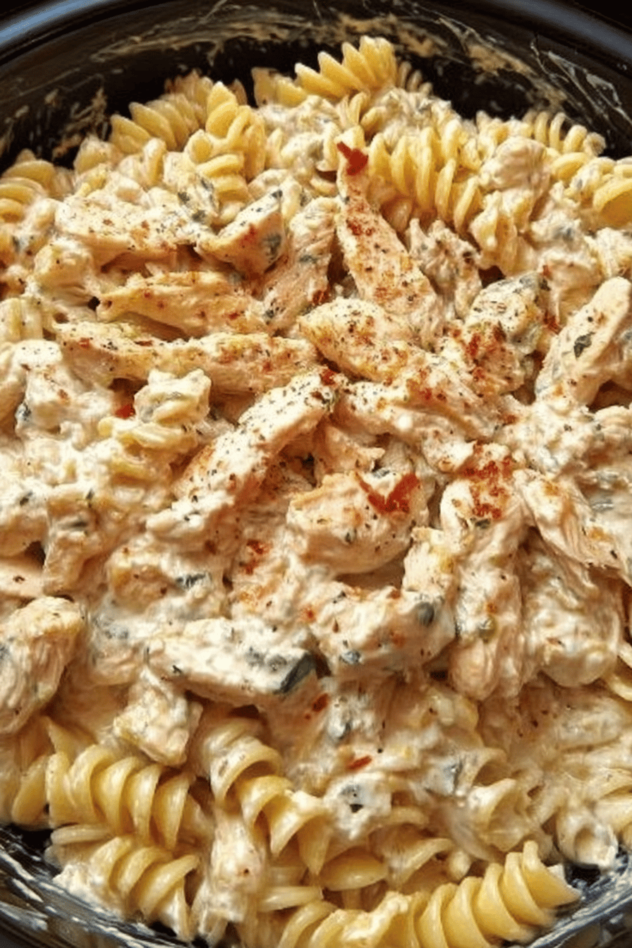 Crockpot Garlic Parmesan Chicken Pasta Recipe slice on plate showing perfect texture and swirl pattern